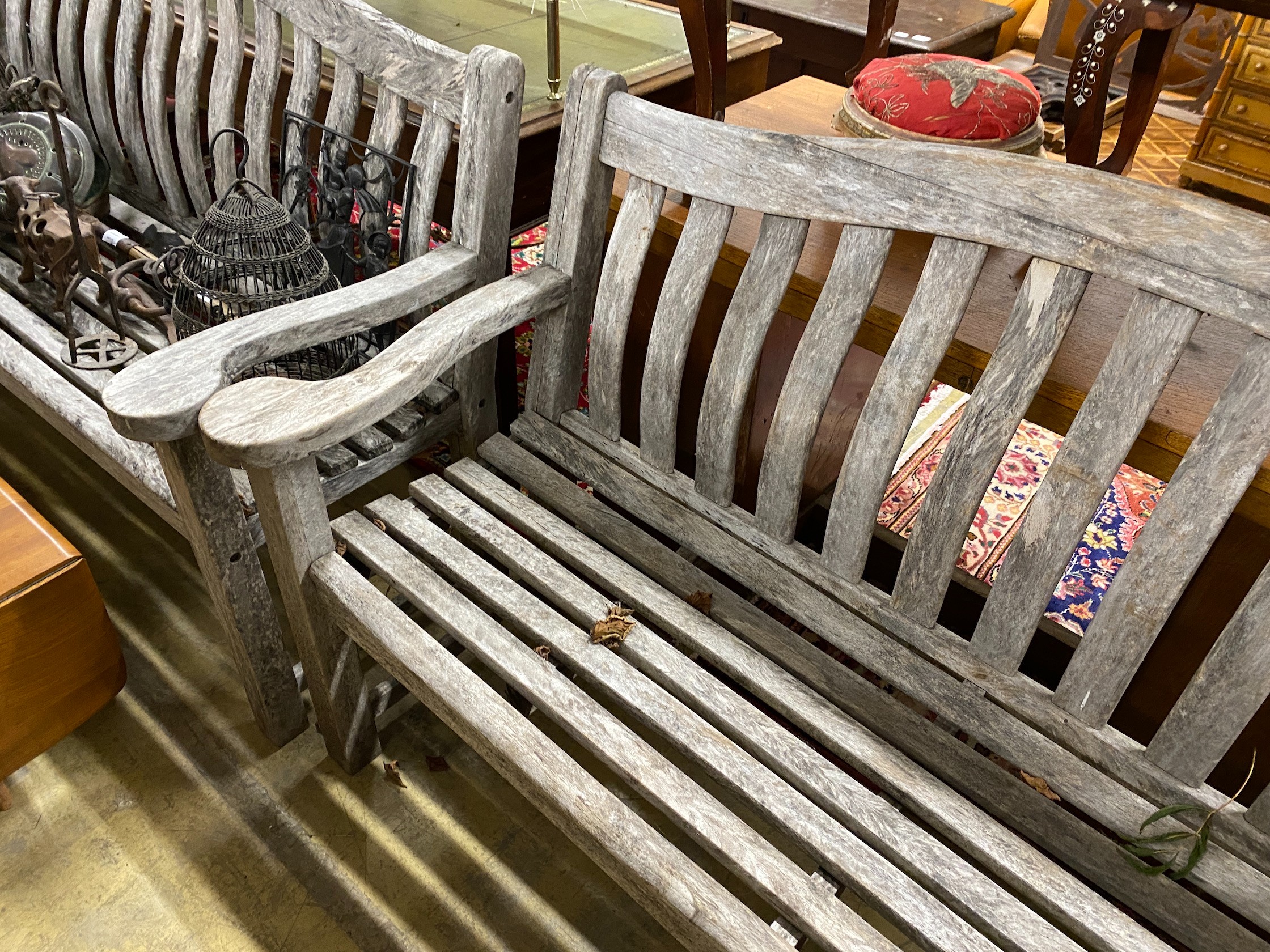 A pair of Alexander Rose weathered teak garden benches, length 155cm, depth 48cm, height 98cm